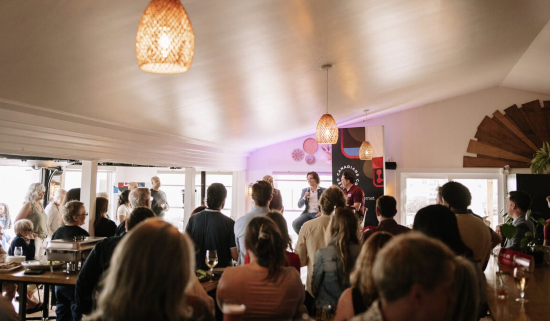 A full room listening to a talk