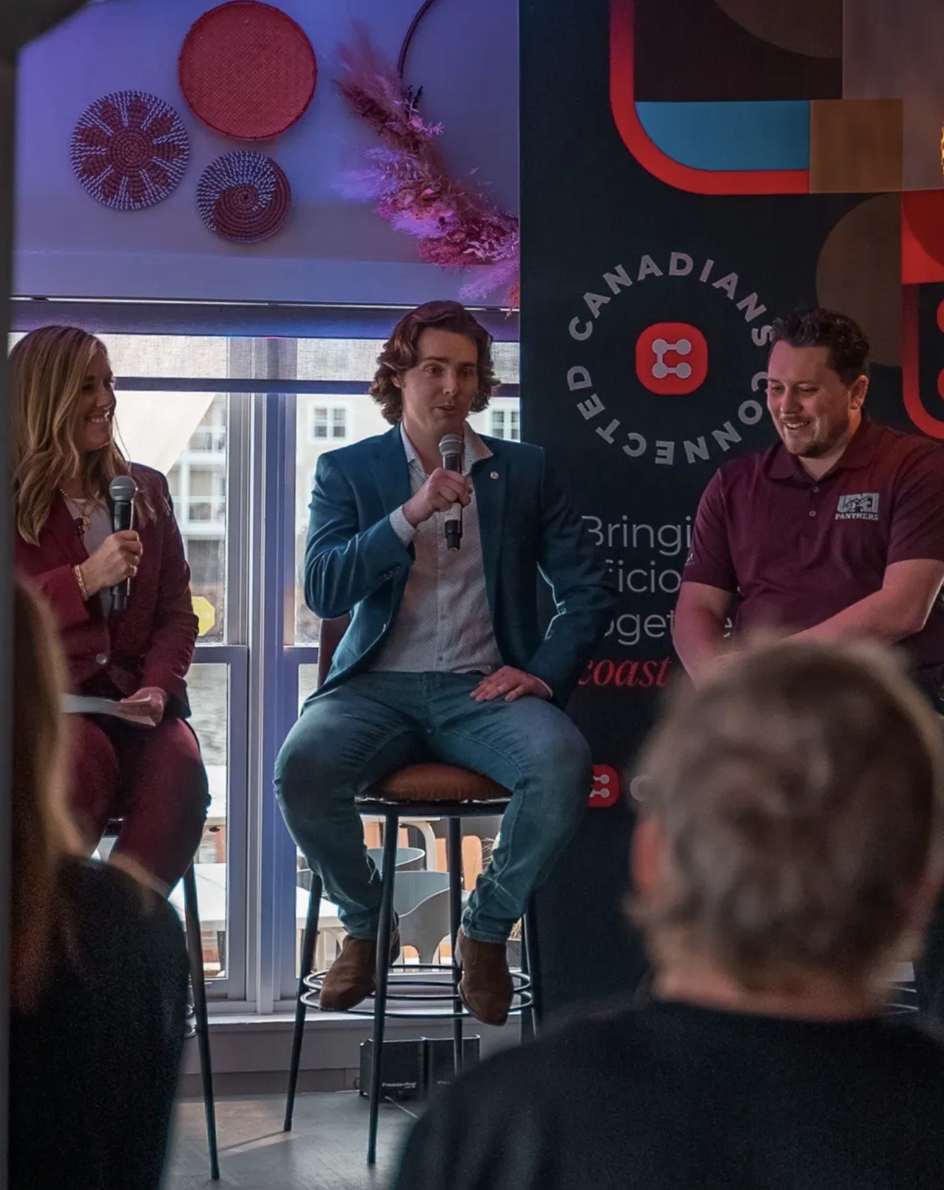 Coltin on a panel at a CIRA event